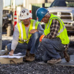Workers collaborating on project